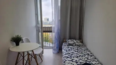 Łóżko lub łóżka w pokoju w obiekcie Grzybowska Pokoje Centrum
