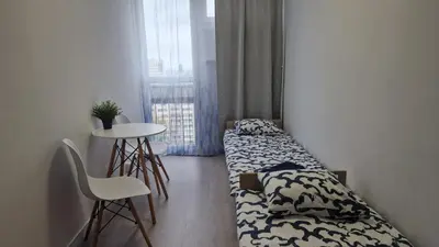 Łóżko lub łóżka w pokoju w obiekcie Grzybowska Pokoje Centrum