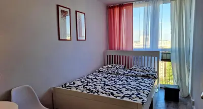 Łóżko lub łóżka w pokoju w obiekcie Grzybowska Pokoje Centrum