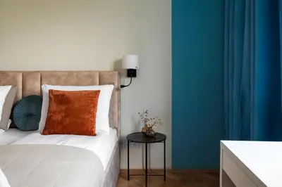 Łóżko lub łóżka w pokoju w obiekcie Warsaw Dream Apartment by BookingHost