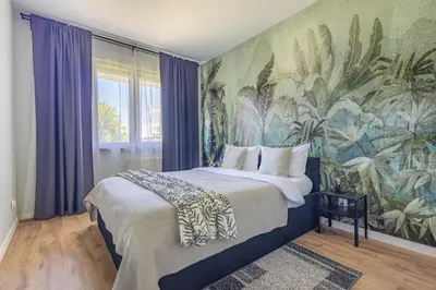 Łóżko lub łóżka w pokoju w obiekcie Apartament Wilanow
