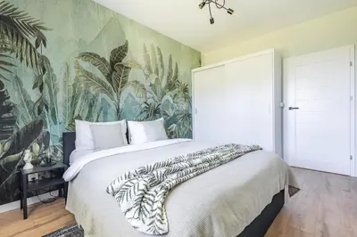 Łóżko lub łóżka w pokoju w obiekcie Apartament Wilanow