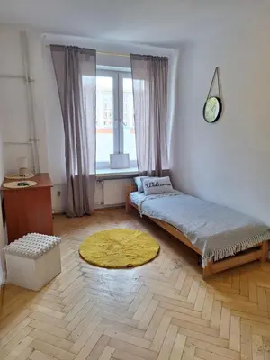 Łóżko lub łóżka w pokoju w obiekcie Regem Aleja Solidarności