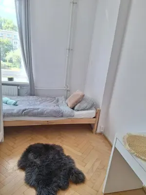Łóżko lub łóżka w pokoju w obiekcie Regem Aleja Solidarności