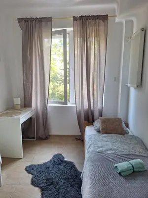 Łóżko lub łóżka w pokoju w obiekcie Regem Aleja Solidarności