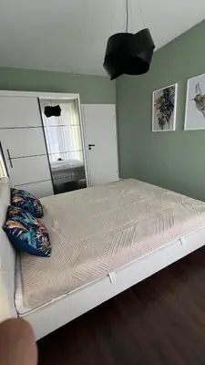 Łóżko lub łóżka w pokoju w obiekcie Apartament Rytm - Metro Kabaty