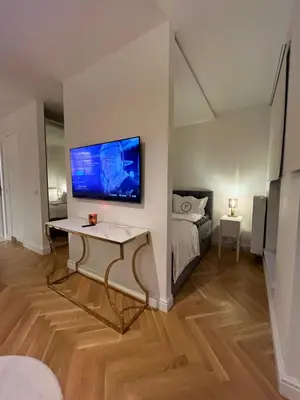 Łóżko lub łóżka w pokoju w obiekcie Studio - Podskarbińska