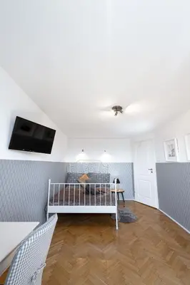 Łóżko lub łóżka w pokoju w obiekcie ClickTheFlat Wilson Square Apart Rooms