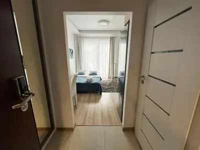 Łóżko lub łóżka w pokoju w obiekcie Kasprzaka 31 By Perfect Apart 231 Garaż