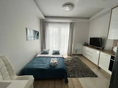 Telewizja i/lub zestaw kina domowego w obiekcie Kasprzaka 31 By Perfect Apart 231 Garaż