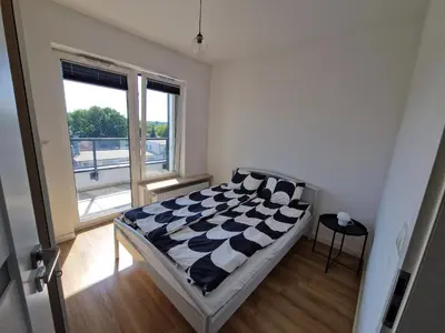 Łóżko lub łóżka w pokoju w obiekcie Apartament Oszmiańska