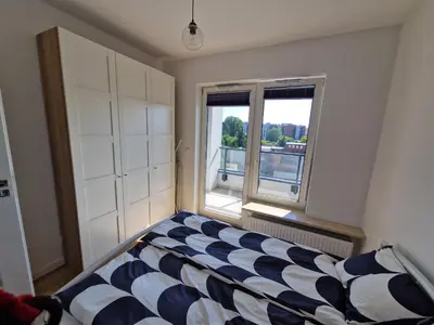 Łóżko lub łóżka w pokoju w obiekcie Apartament Oszmiańska