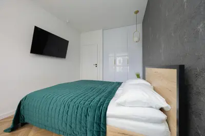 Łóżko lub łóżka w pokoju w obiekcie Nowoczesny Apartament z balkonem i miejscem parkingowym Warszawa Ursus by Noclegi Renters