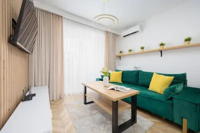 Telewizja i/lub zestaw kina domowego w obiekcie Nowoczesny Apartament z balkonem i miejscem parkingowym Warszawa Ursus by Noclegi Renters