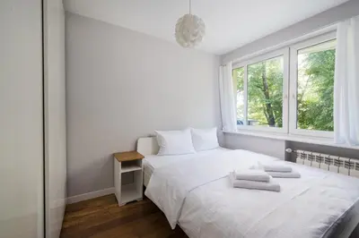 Łóżko lub łóżka w pokoju w obiekcie Solec Powiśle Pleasant Apartment by BookingHost