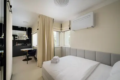 Łóżko lub łóżka w pokoju w obiekcie Nowolipki Deluxe Grey Studio