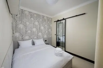 Łóżko lub łóżka w pokoju w obiekcie Nowolipki Deluxe Grey Studio