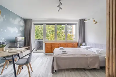 Łóżko lub łóżka w pokoju w obiekcie City Center Apartment