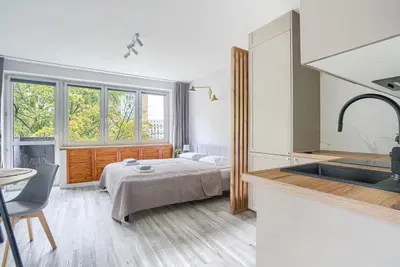 Łóżko lub łóżka w pokoju w obiekcie City Center Apartment