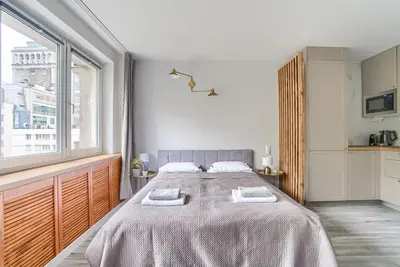 Łóżko lub łóżka w pokoju w obiekcie City Center Apartment