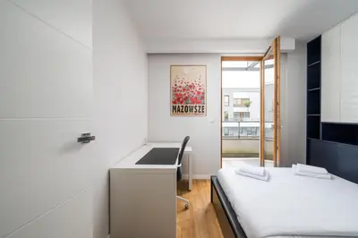 Łóżko lub łóżka w pokoju w obiekcie New Varsovia Comfort 569 by BookingHost