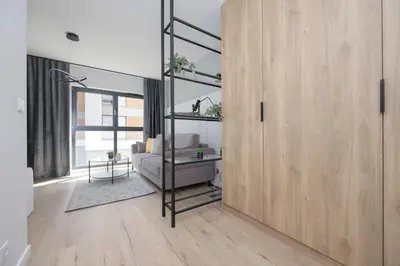 Łóżko lub łóżka w pokoju w obiekcie Piękne Studia dla 3 osób & Parking Warszawa by Noclegi Renters