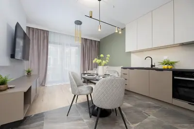 Kuchnia lub aneks kuchenny w obiekcie Piękne Studia dla 3 osób & Parking Warszawa by Noclegi Renters