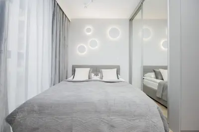 Łóżko lub łóżka w pokoju w obiekcie Wyjątkowe Studia w Warszawie by Noclegi Renters