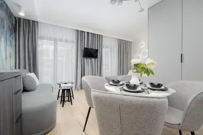 Telewizja i/lub zestaw kina domowego w obiekcie Wyjątkowe Studia w Warszawie by Noclegi Renters