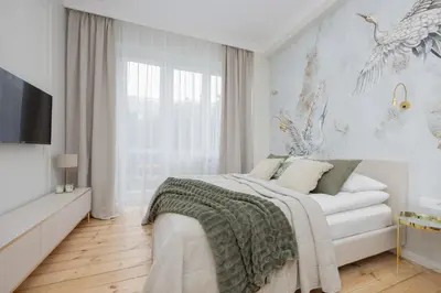 Łóżko lub łóżka w pokoju w obiekcie Elegant Apartments Grójecka in Warsaw by Noclegi Renters