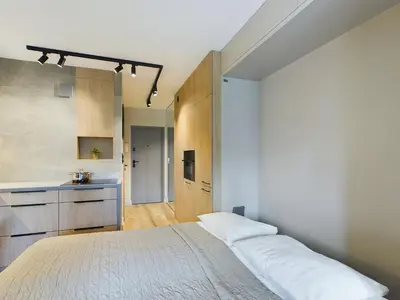Łóżko lub łóżka w pokoju w obiekcie Beautiful Studio for Two People by Noclegi Renters
