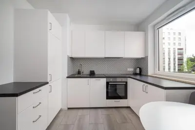 Kuchnia lub aneks kuchenny w obiekcie Dunikowskiego Comfy Apartments by BookingHost