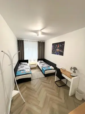 Łóżko lub łóżka w pokoju w obiekcie Stary Mokotów