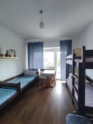 Łóżko lub łóżka w pokoju w obiekcie Lubava