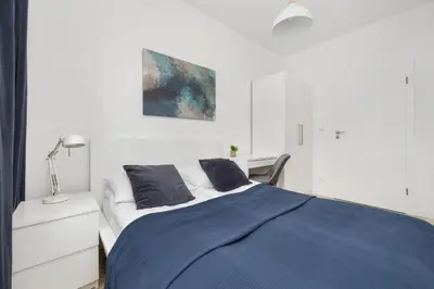 Łóżko lub łóżka w pokoju w obiekcie Comfy Two-Bedroom Apartment near Chopin Airport Warsaw's Ursynów by Noclegi Renters