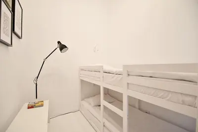 Łóżko lub łóżka w pokoju w obiekcie White Boho Apartment