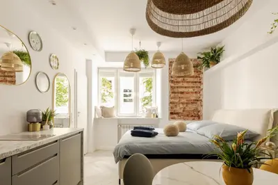Łóżko lub łóżka w pokoju w obiekcie Cozy Studio Poznanska Downtown Quiet