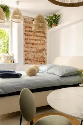 Łóżko lub łóżka w pokoju w obiekcie Cozy Studio Poznanska Downtown Quiet