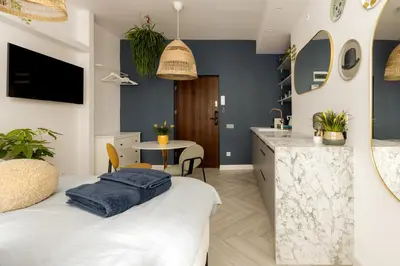 Łóżko lub łóżka w pokoju w obiekcie Cozy Studio Poznanska Downtown Quiet