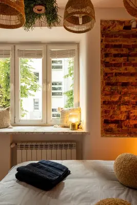 Łóżko lub łóżka w pokoju w obiekcie Cozy Studio Poznanska Downtown Quiet