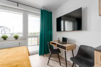 Telewizja i/lub zestaw kina domowego w obiekcie Chill Apartments Pileckiego