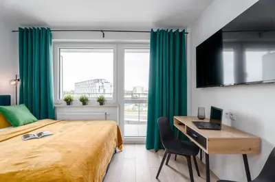 Łóżko lub łóżka w pokoju w obiekcie Chill Apartments Pileckiego