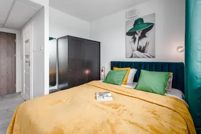 Łóżko lub łóżka w pokoju w obiekcie Chill Apartments Pileckiego