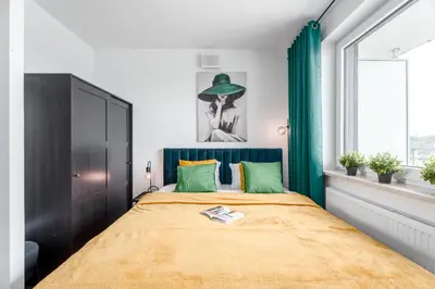 Łóżko lub łóżka w pokoju w obiekcie Chill Apartments Pileckiego