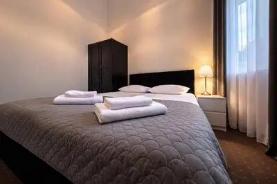 Łóżko lub łóżka w pokoju w obiekcie Hotel Mazowiecki WOW
