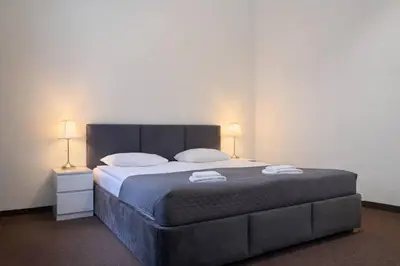 Łóżko lub łóżka w pokoju w obiekcie Hotel Mazowiecki WOW
