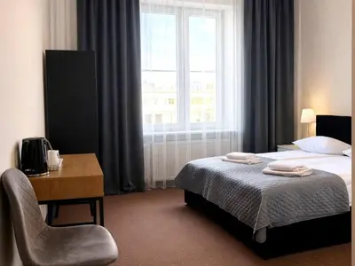 Łóżko lub łóżka w pokoju w obiekcie Hotel Mazowiecki WOW