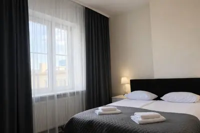 Łóżko lub łóżka w pokoju w obiekcie Hotel Mazowiecki WOW