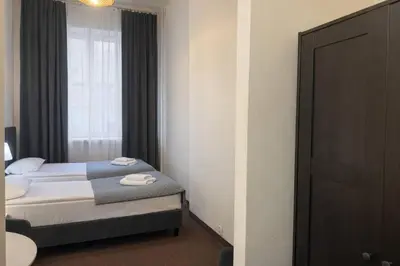 Łóżko lub łóżka w pokoju w obiekcie Hotel Mazowiecki WOW