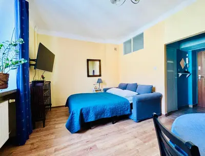 Łóżko lub łóżka w pokoju w obiekcie Five Colors Apartment Warsaw